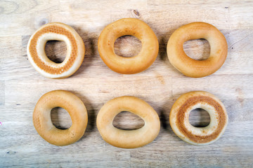 Round bagels on wooden background. Top view