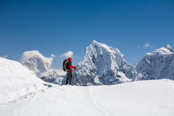 Trekker is walking by Renjo La pass in Everest region