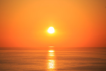 Fototapeta na wymiar Beautiful sunset with reflection on the sea