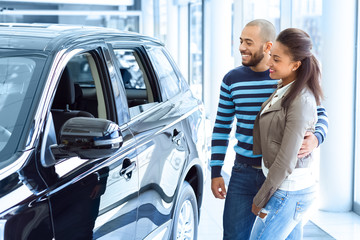 Beautiful African couple buying a car together