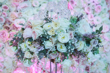 Roses on a stand with beads.