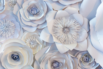 Wall with a background of paper flowers handmade.