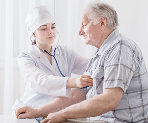 doctor with elderly men indoor