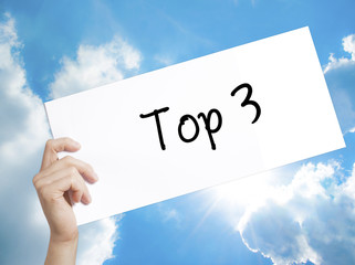 Top 3 Sign on white paper. Man Hand Holding Paper with text. Isolated on sky background