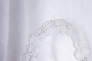 Invisible aligner teeth retainer