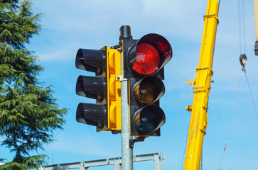 Red traffic light in the city street