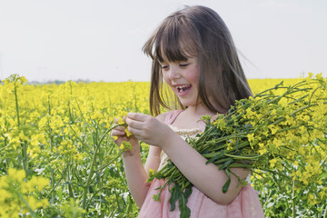 The little girl in a field of flowers