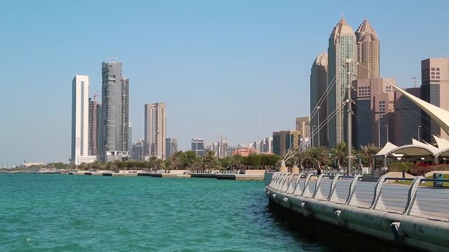 Corniche embankment in Abu Dhabi - capital and second most populous city in United Arab Emirates after Dubai, also capital of Abu Dhabi emirate. Abu Dhabi emirate is largest of seven emirates in UAE