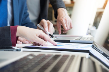 Team work process. young business managers crew working with new startup project. labtop on wood table, typing keyboard, texting message, analyse graph plans