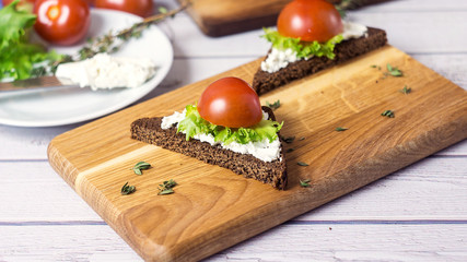 Healthy Snacks Sandwiches with goat cheese, salad, cherry tomatoes