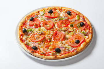 Italian delicious pizza with tomato, broccoli and cheese.