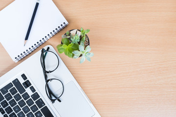 Looking for direction and inspiration, Business working at an office, Office desk table with computer, supplies, flower. Top view. Copy space for text,