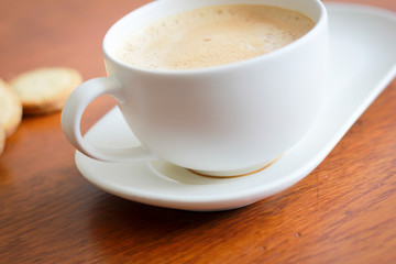 Coffee with white cup on wooden background