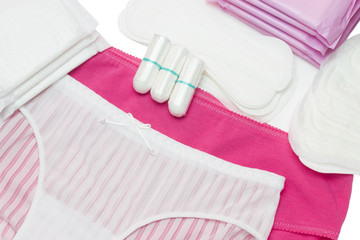 Menstruation sanitary pads and cotton tampon for woman hygiene protection. White and pink pants. Soft and tender protection for woman critical days, gynecological menstruation cycle