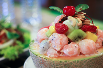 The fruit salad in a melon bowl