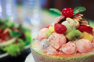 The fruit salad in a melon bowl