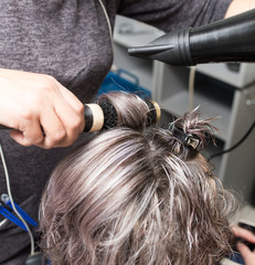 Naklejka premium Styling female hair dryer