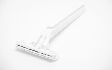Closeup of white plastic shaver isolated on white background.