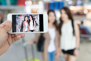 Taking photo on cellphone in Hong Kong international airport