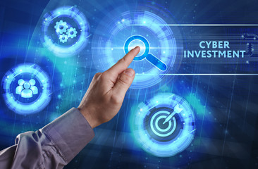 Business, Technology, Internet and network concept. Young businessman working on a virtual screen of the future and sees the inscription: Cyber investment