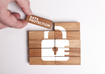 Business, Technology, Internet and network concept. Young businessman shows the word: Data protection