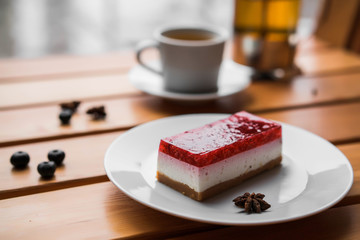 Tasty dessert with fruits on wooden table and tea