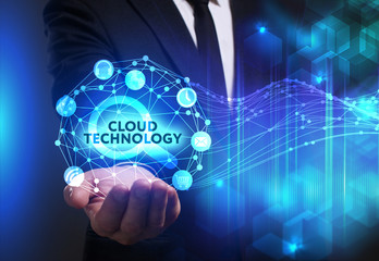 Business, Technology, Internet and network concept. Young businessman working on a virtual screen of the future and sees the inscription: Cloud technology