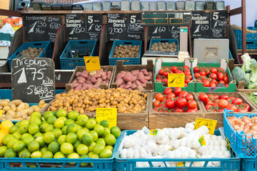 Fresh vegetables on vegetables market in Amsterdam, Netherland. Many vegetables in basket for sell. Vegetables retail in Amsterdam, Netherland