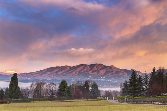 Sunrise at Azzate Belvedere. Campo dei Fiori and Sacro Monte di Varese are visible at the top of the mountains. Azzate, Varese, Lombardy, Italy.