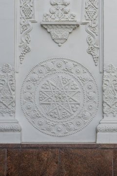 Decorative ornament on the wall. Stone carving