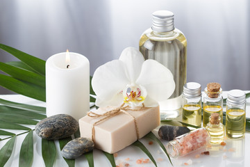 Obraz na płótnie Canvas Aroma oil for aromatherapy,candle,stone,orchid blossom,Himalayan salt