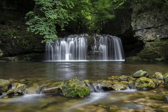 The Ferrera waterfall in a spring flood, Ferrera di Varese, Lombardy, Italy.