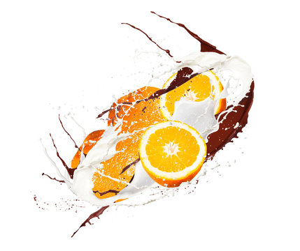 Fruit, orange in milk splash, isolated on white background