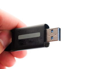 isolated close up on usb in a hand
