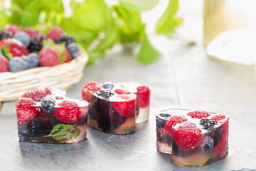 Homemade hearts of berries aspic with Moscato wine in backlight.