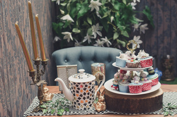 Dessert table for a party cupcake. Cupcake party on the table in garden.
