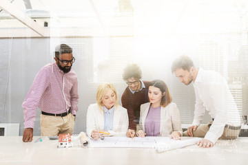 business team discussing house project at office