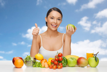 woman with fruits and vegetables showing thumbs up