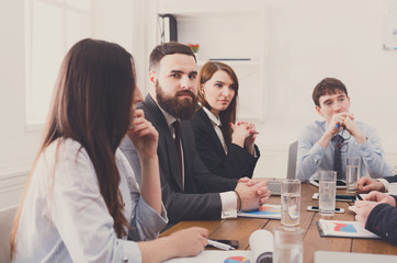 Business meeting. Young hipsters businessmen and women at modern