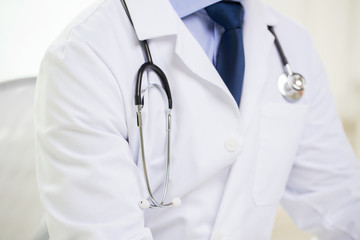 close up of male doctor with stethoscope