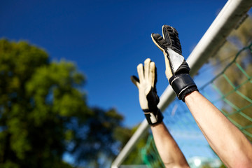 goalkeeper or soccer player at football goal