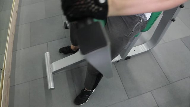 Guy trains hands in the gym