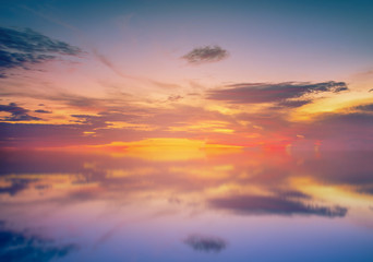 Long Exposure of Colorful sunset sky and reflection on sea in Phuket, Thailand.