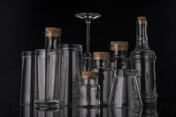 Glass, transparent glassware with beautiful white highlights on a black background.