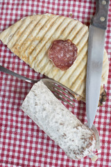 toast made with flat bread and salami