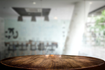 Selected focus empty brown wooden table and meeting room or office work blur background image. for your photomontage or product display