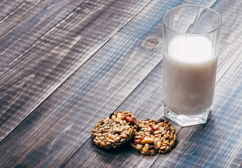 A light breakfast consisting of a glass of milk and two pieces of kozinak. There is place for text