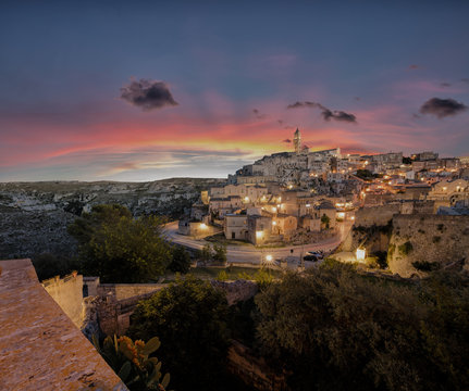 Sunset on the ancient town and historical center called Sassi, perched on rocks on top of hill, Matera, Basilicata