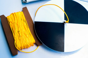 Secchi disk with rope on a white table
