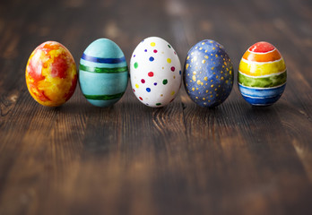 Easter colorful eggs on wooden background